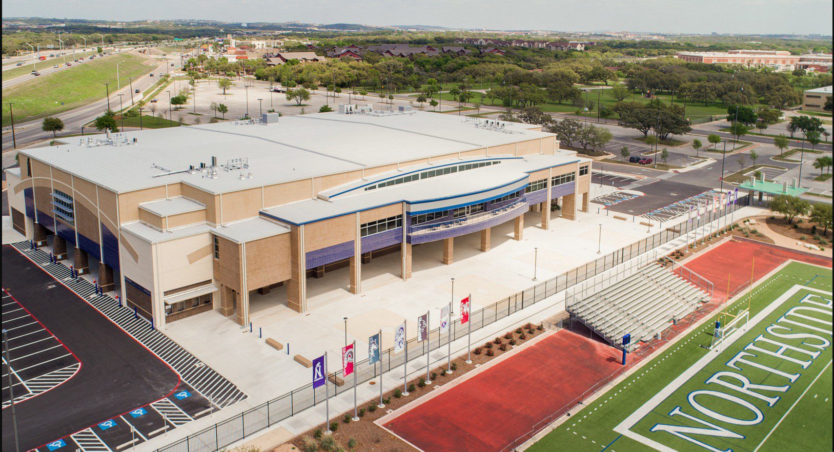 An aerial view of a stadium with many flags on it.