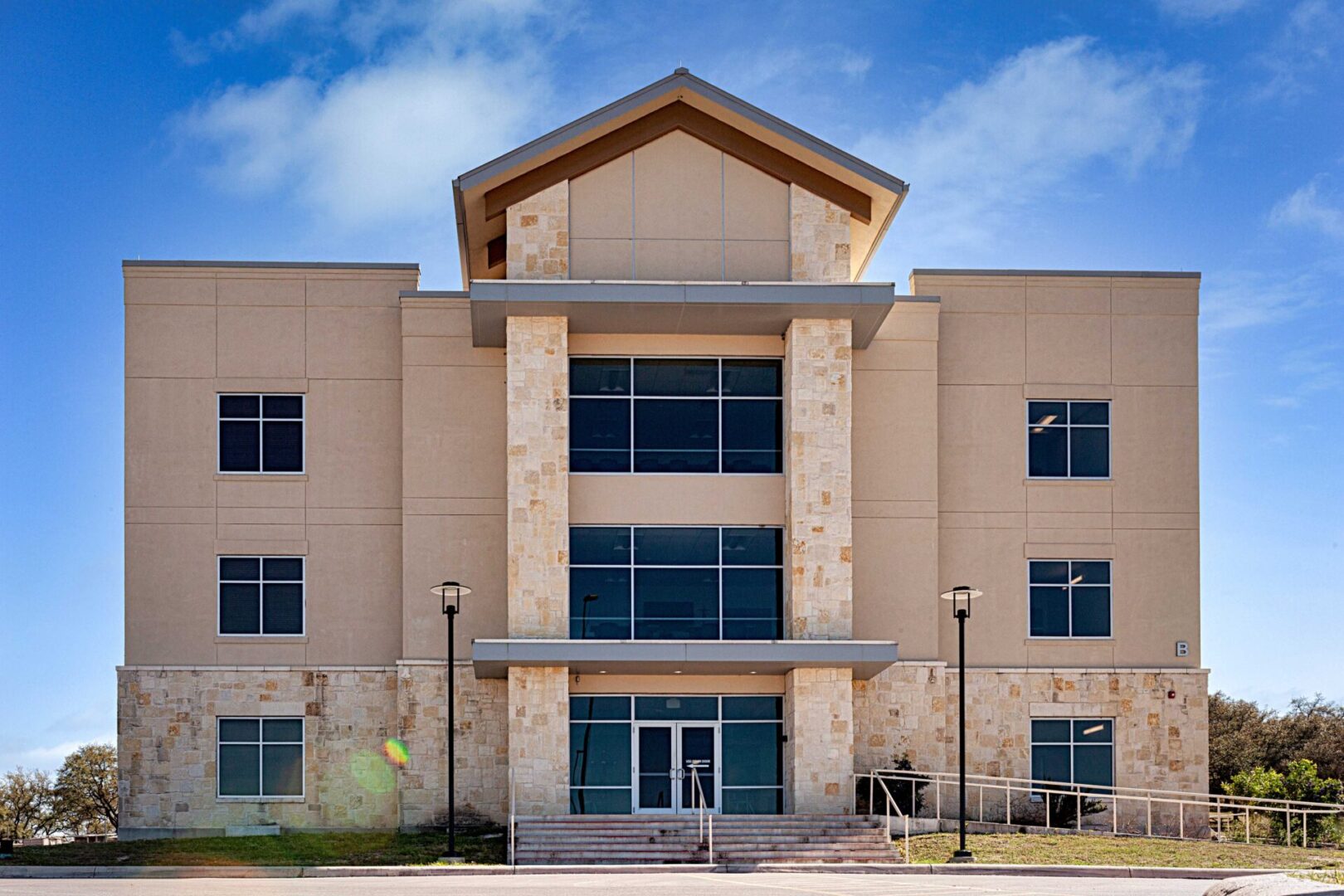 A large building with many windows and lights.