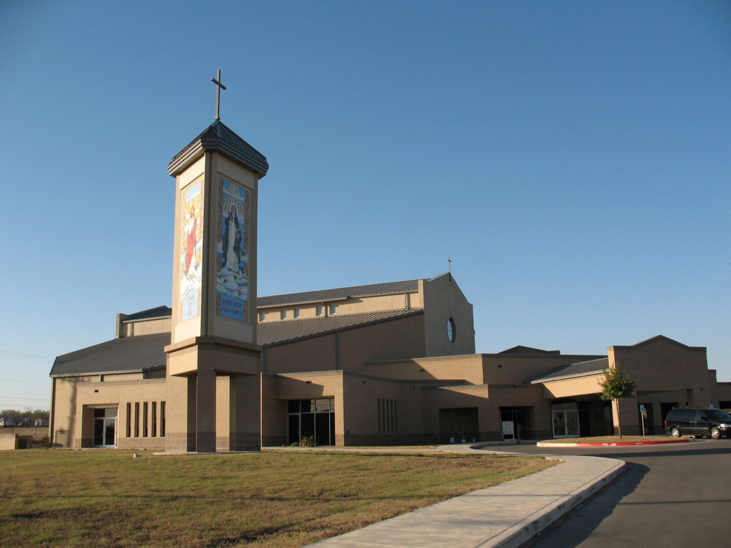 A church with a clock tower and a building